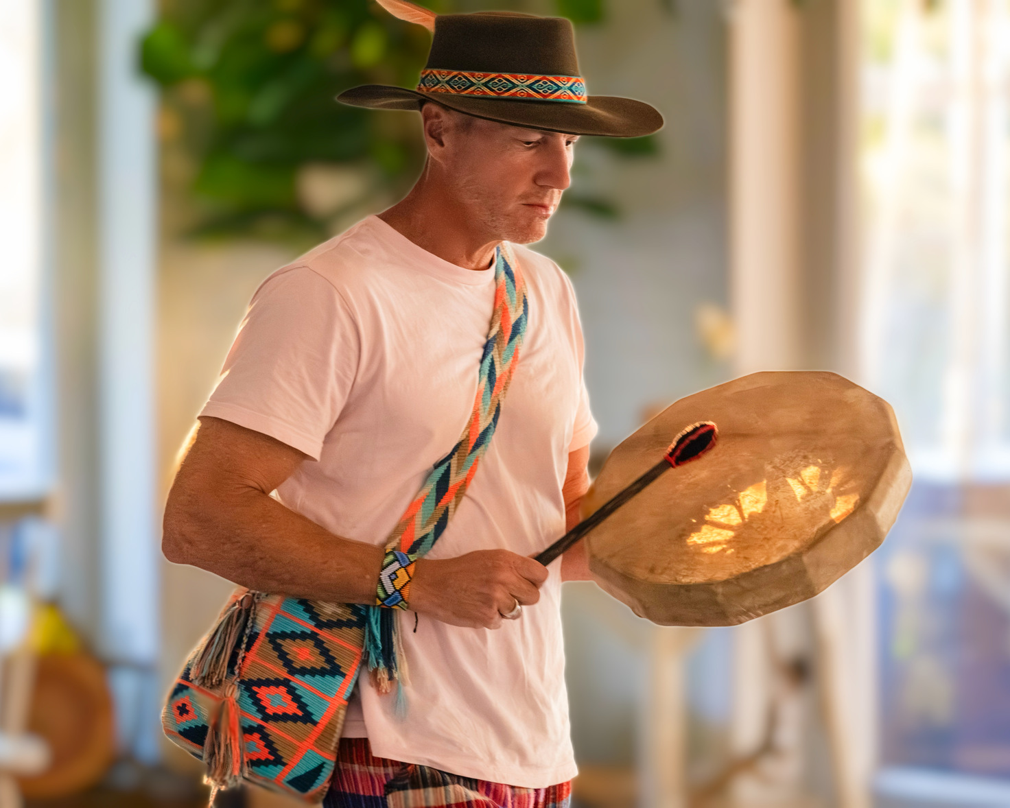 Jonathan drumming in ceremony